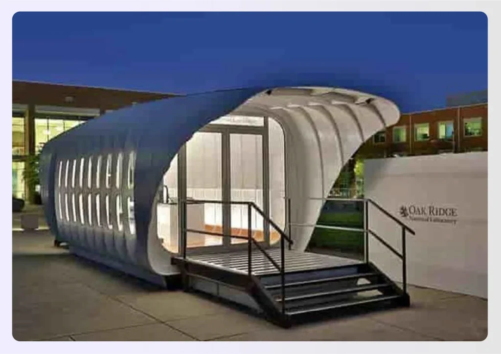 The exterior of a modern, curved 3D printed building