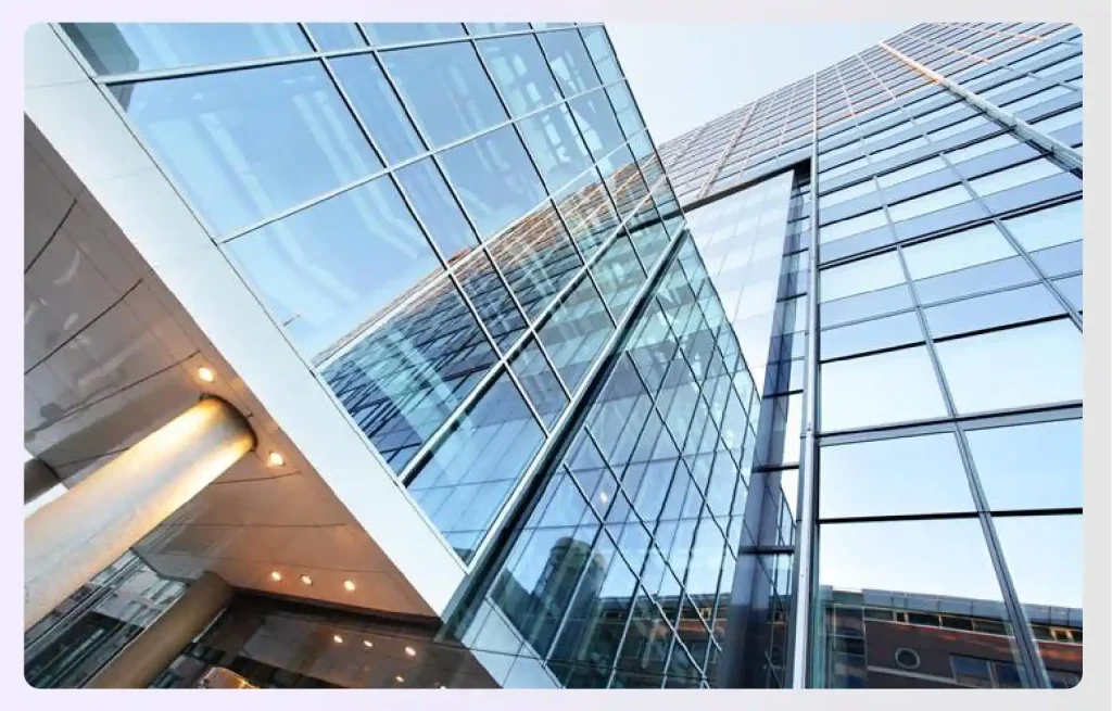 A modern glass building reflecting the skyย A modern glass building reflecting the skyย