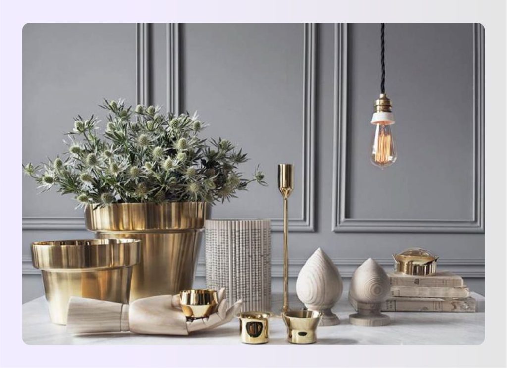 Gold and brass decorative items on a table