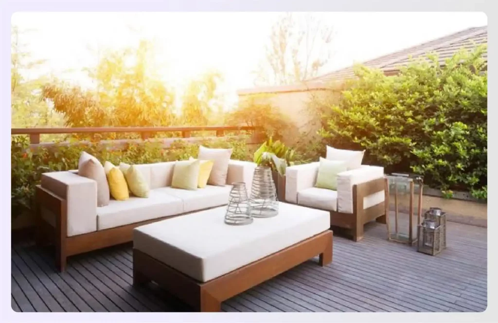 A covered terrace featuring a large outdoor sectional sofa