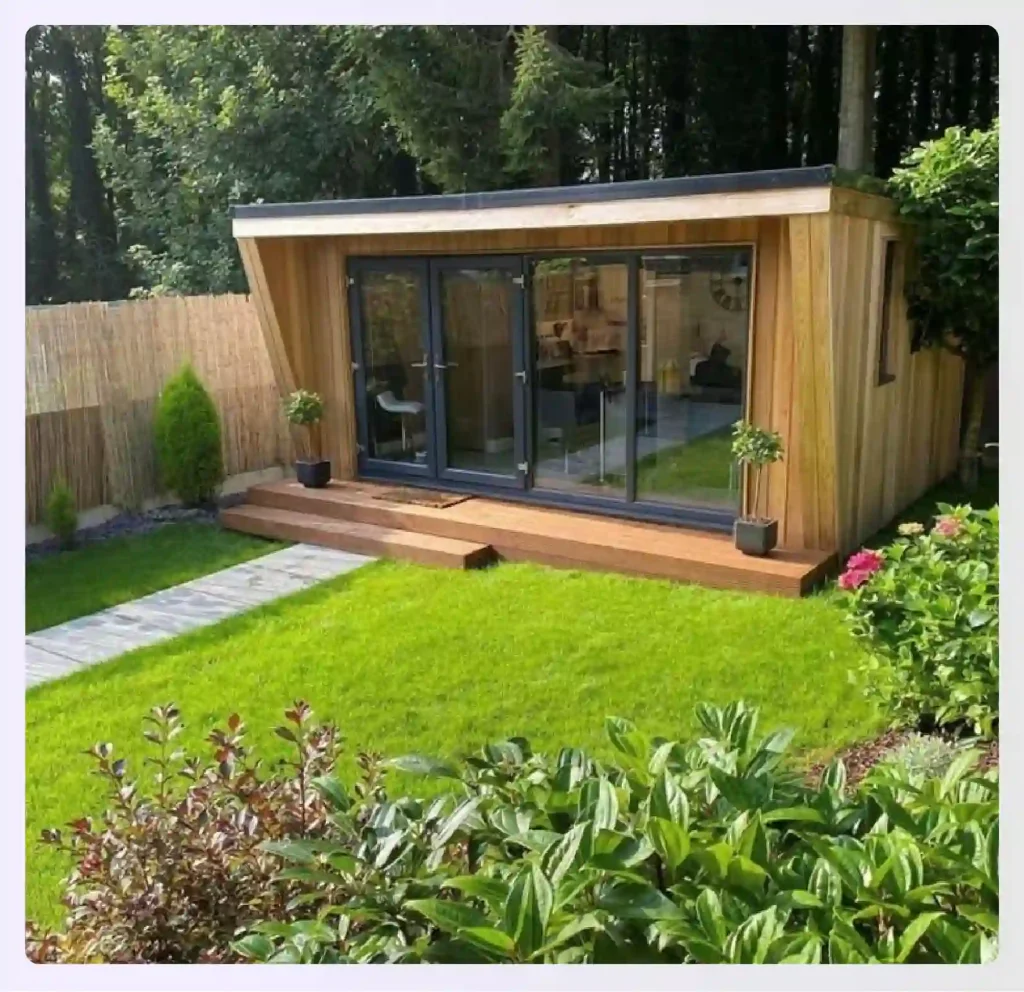 A modern garden outhouse with a small wooden dec
