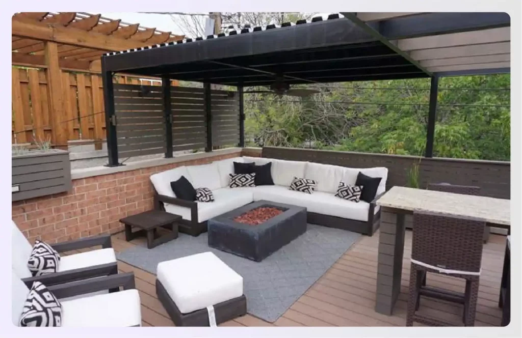 A modern terrace featuring a pergola and fire pit