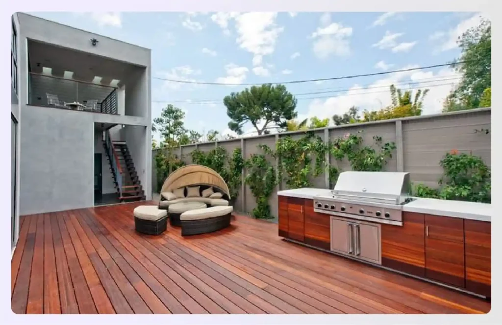 An outdoor kitchen and seating area on a terrace
