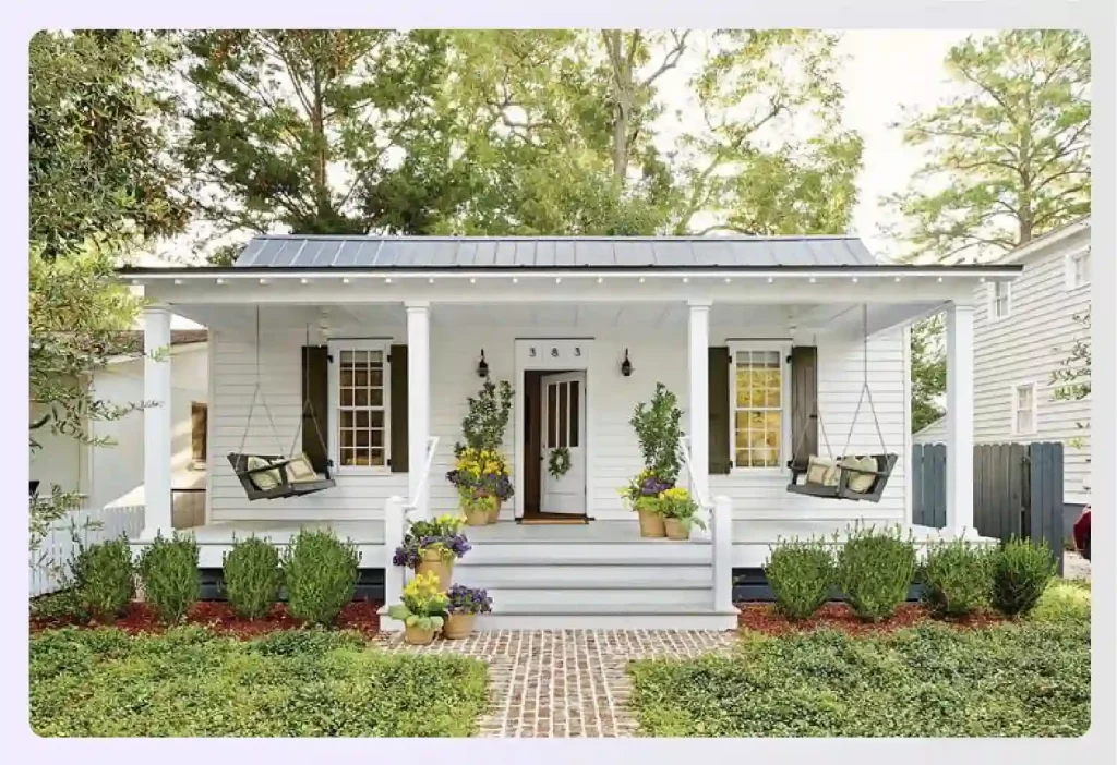 White bungalow with a welcoming front porch swing