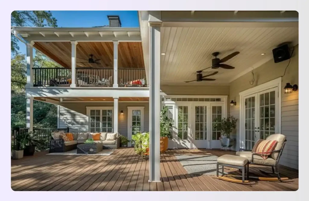 Cozy under-deck patio with wood flooring and wicker sofas
