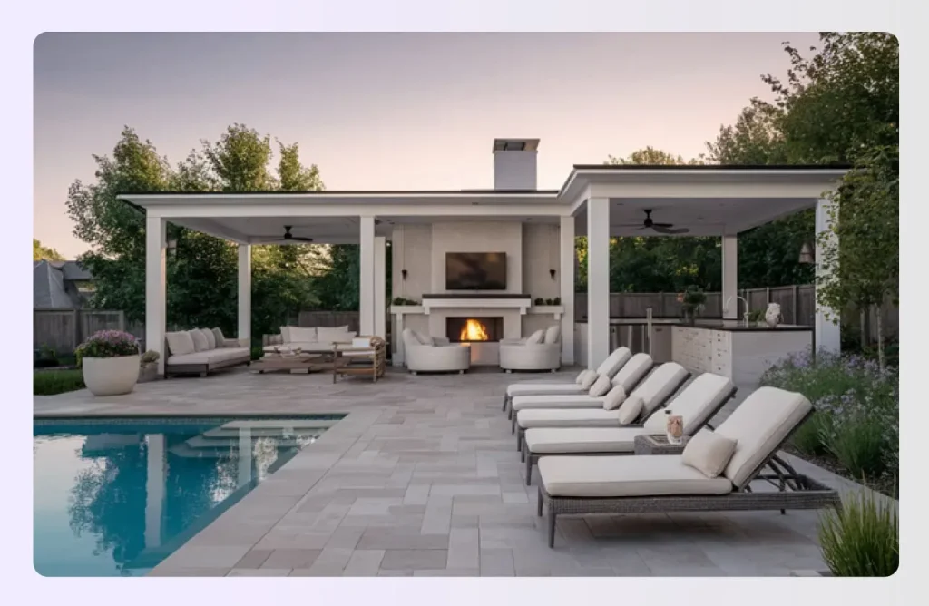 Expansive poolside patio with pavilion, fireplace, and lounge chairs