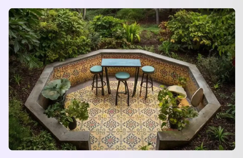 Tiny octagonal patio nook with colorful tiles and stools