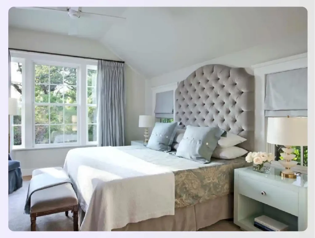 A serene bedroom with a neutral grey color scheme