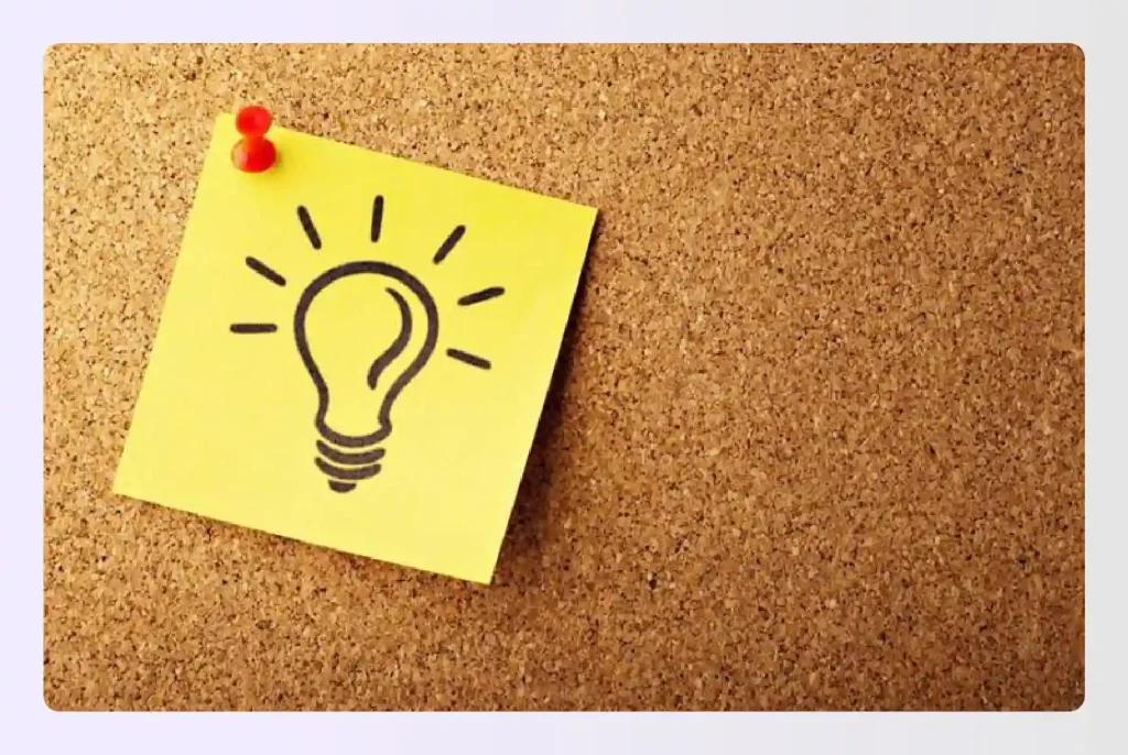 Glowing lightbulb sketch on a yellow sticky note Glowing lightbulb sketch on a yellow sticky note