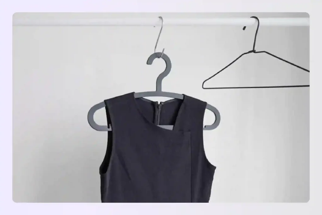 Neat black dress on a clothing hanger Neat black dress on a clothing hanger