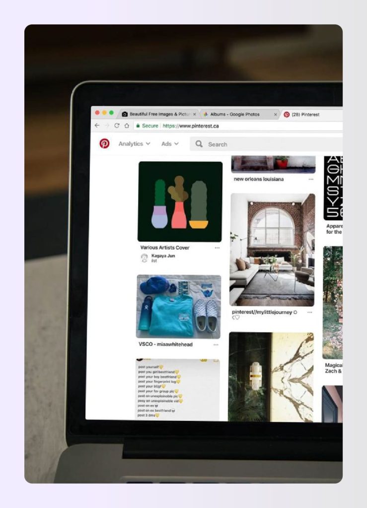 Laptop screen displaying Pinterest interior design boards Laptop screen displaying Pinterest interior design boards
