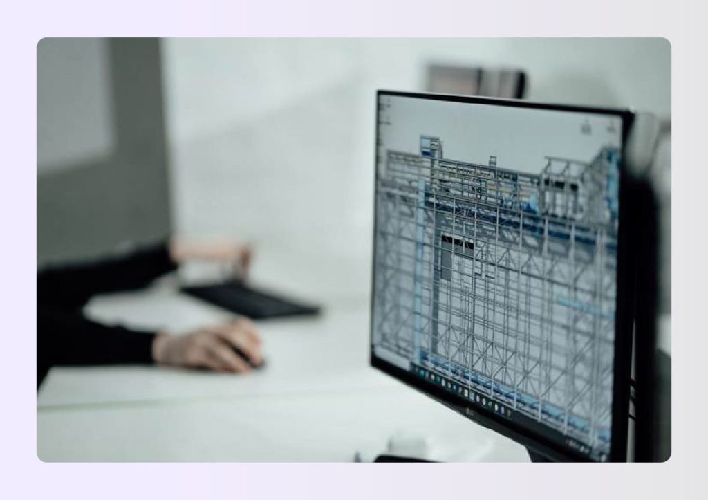 Designer working on complex CAD drawings on monitor