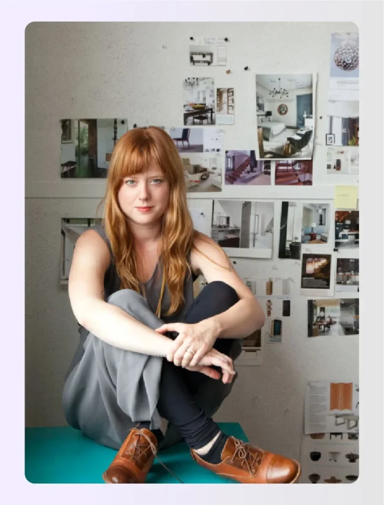 Lauren Geremia sitting on a teal table in studioย Lauren Geremia sitting on a teal table in studioย