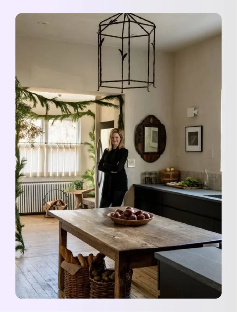 Meg Lavalette standing in a rustic farmhouse kitchenย Meg Lavalette standing in a rustic farmhouse kitchenย