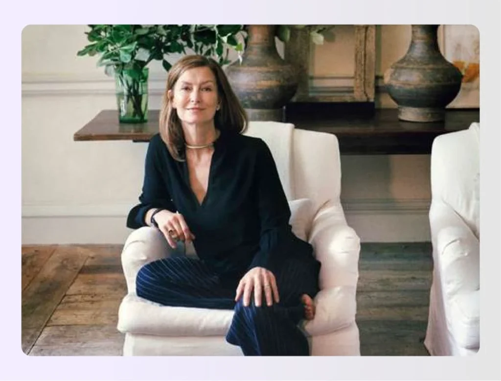 Rose Uniacke sitting in a serene white roomย Rose Uniacke sitting in a serene white roomย