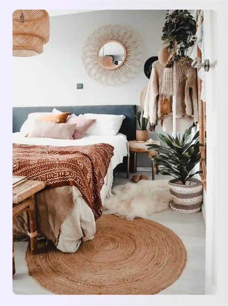 Bedroom featuring jute rug, woven pendant light, and indoor plants Bedroom featuring jute rug, woven pendant light, and indoor plants