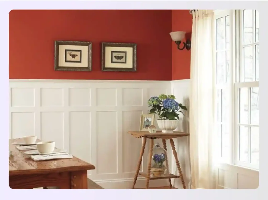 Dining room featuring white wainscoting and contrasting red walls Dining room featuring white wainscoting and contrasting red walls