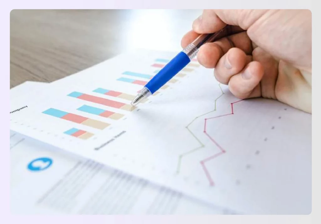A designer analyzing project data from charts and graphs