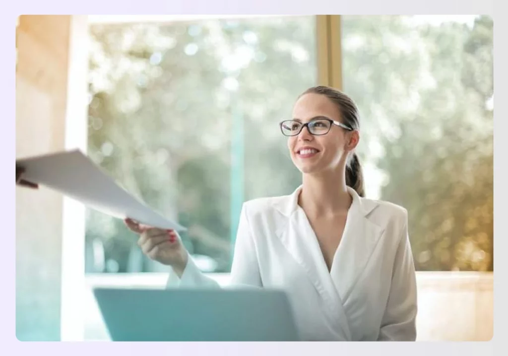 A designer handing over the final project documents to a client