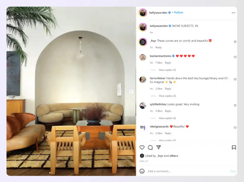 A warm, luxurious lounge area with curved furniture