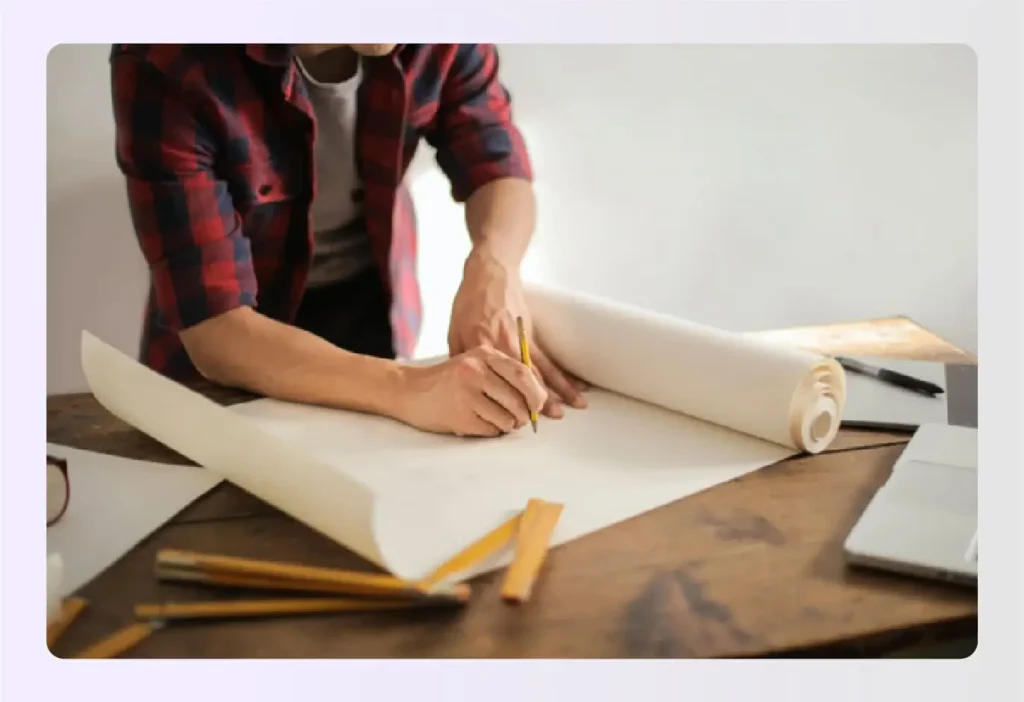 Designer drafting interior design scope of work plans