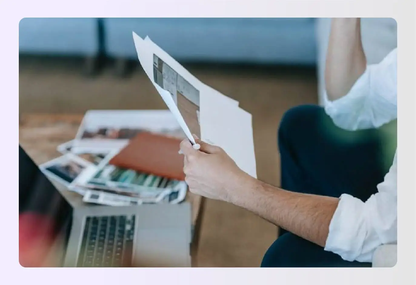 Designer holding interior design scope of work documents