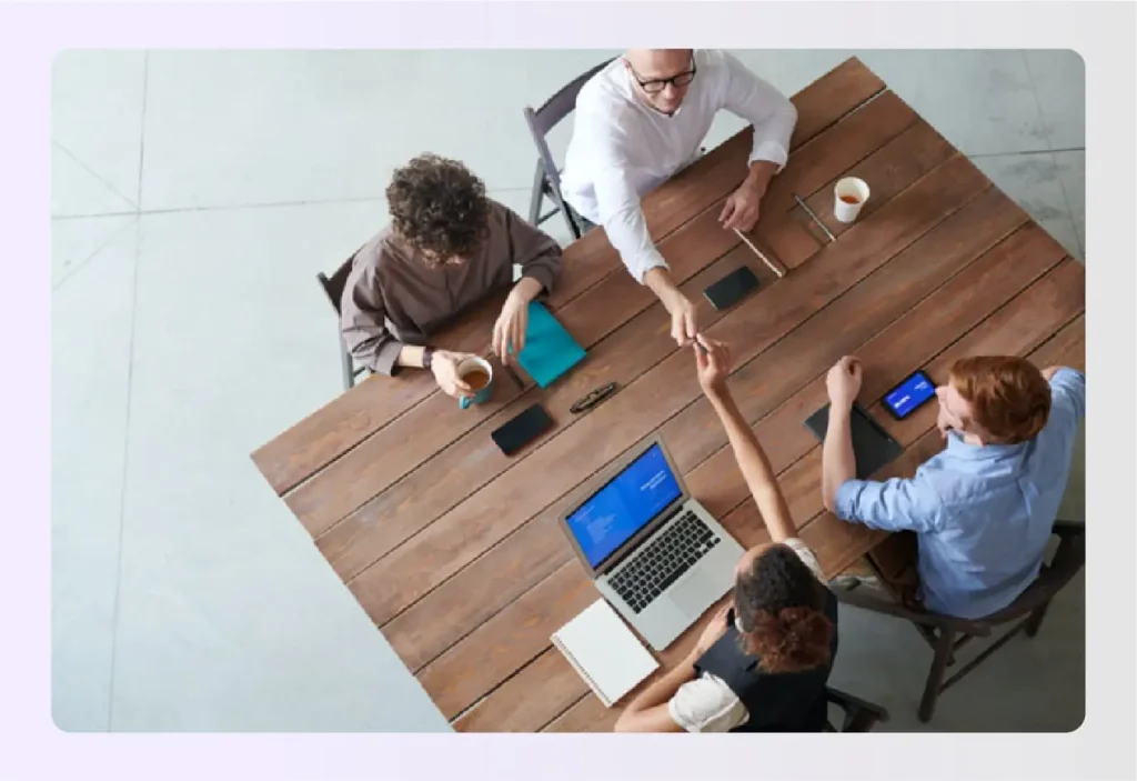 Team meeting discussing interior design scope of work