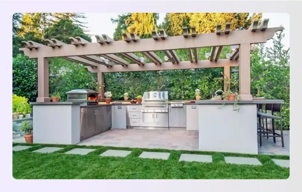 Large U-shaped outdoor kitchen with pergola and bar seating
