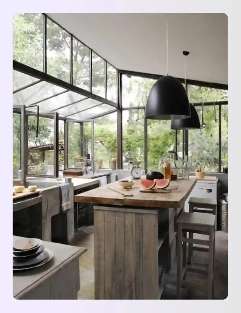 Rustic industrial summer house kitchen with glass walls and concrete counters