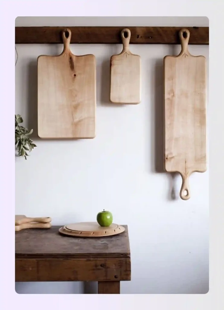 Wooden cutting boards displayed artfully on kitchen wall Wooden cutting boards displayed artfully on kitchen wall