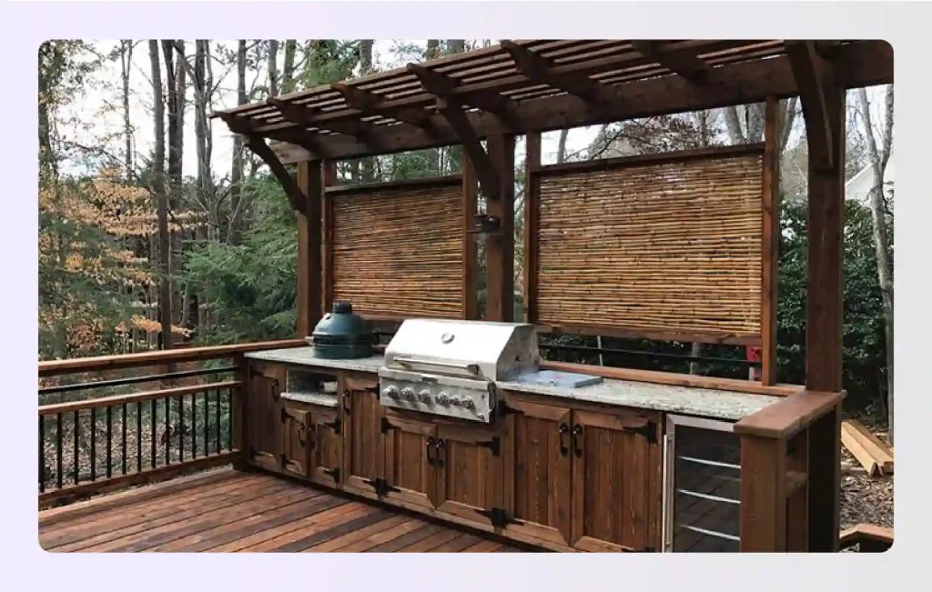 Weathered wood outdoor cabinets with bamboo screens and deck flooring