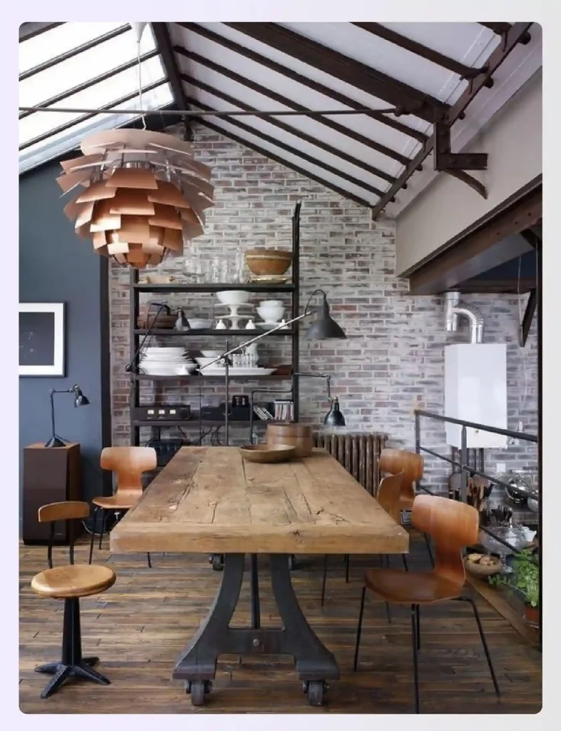 A reclaimed wood dining table in a rustic industrial setting