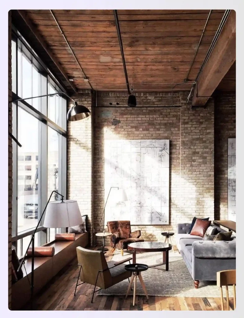 Exposed brick and beams in a sunlit industrial loft space