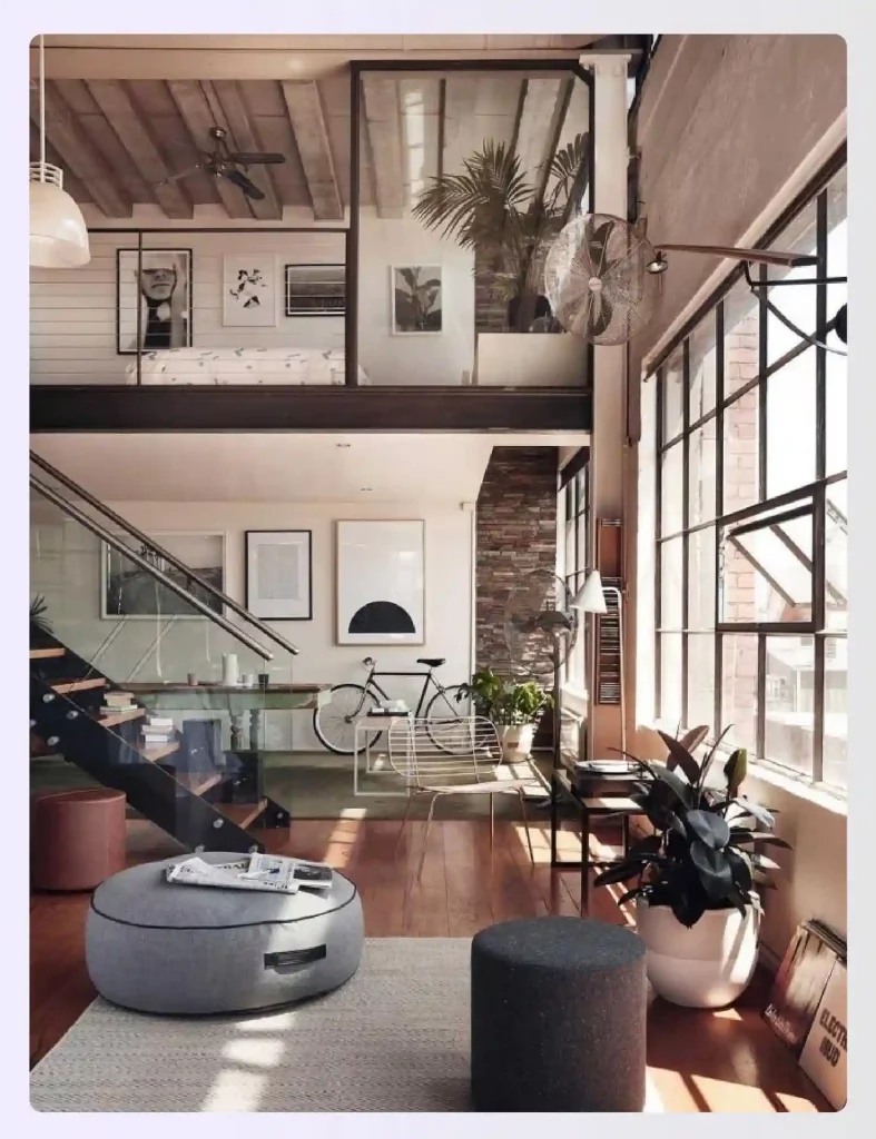 Loft-style windows maximizing natural light in an industrial room.