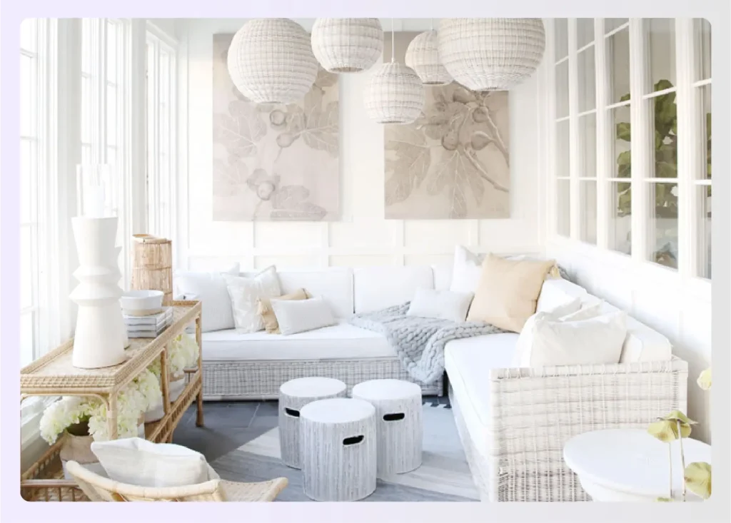 All-white sunroom with wicker furniture
