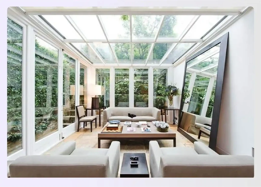 Glass sunroom with a large floor mirror
