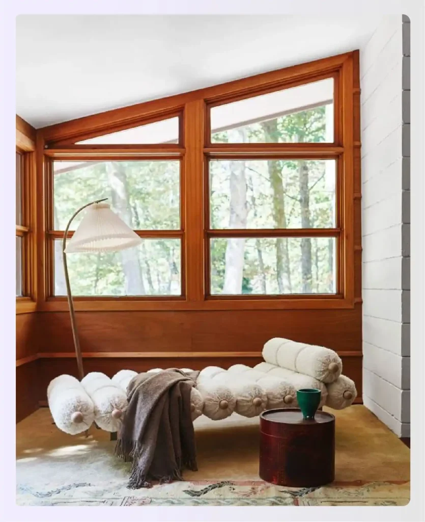 Modern sunroom with bare wood-framed windows