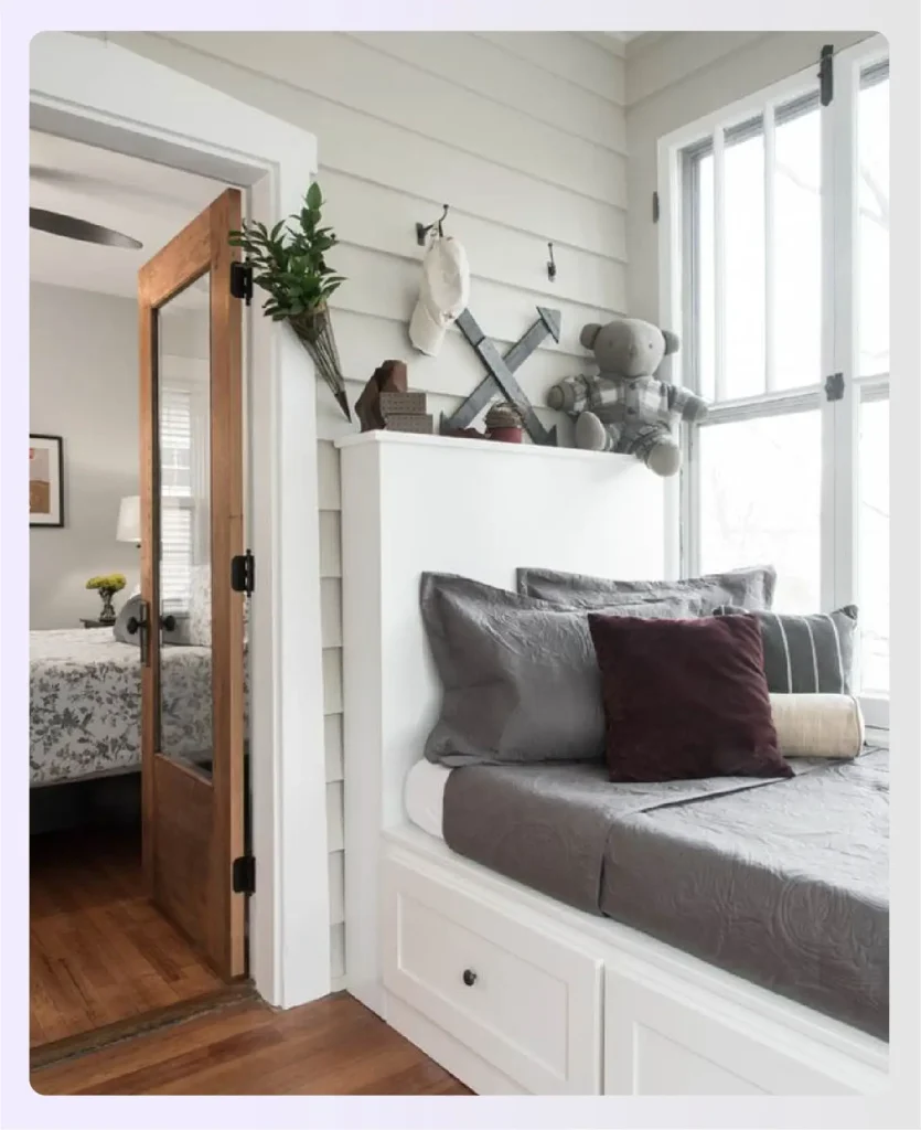 Sunroom corner converted into a guest bed nook