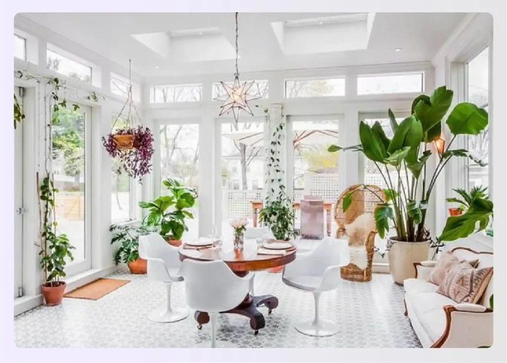 Sunroom filled with various large potted plants