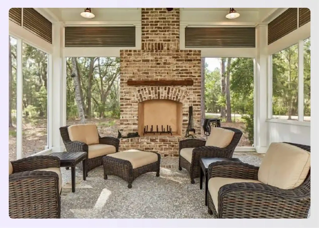 Sunroom with a large brick fireplace