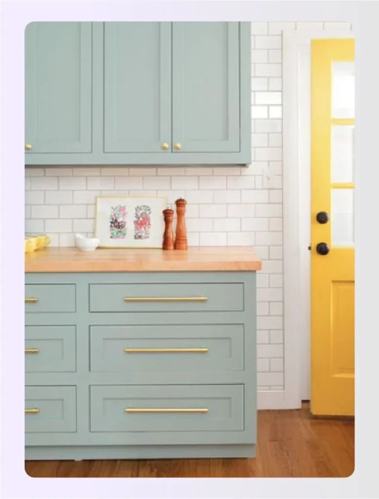 Bright yellow door accenting a grey kitchen 