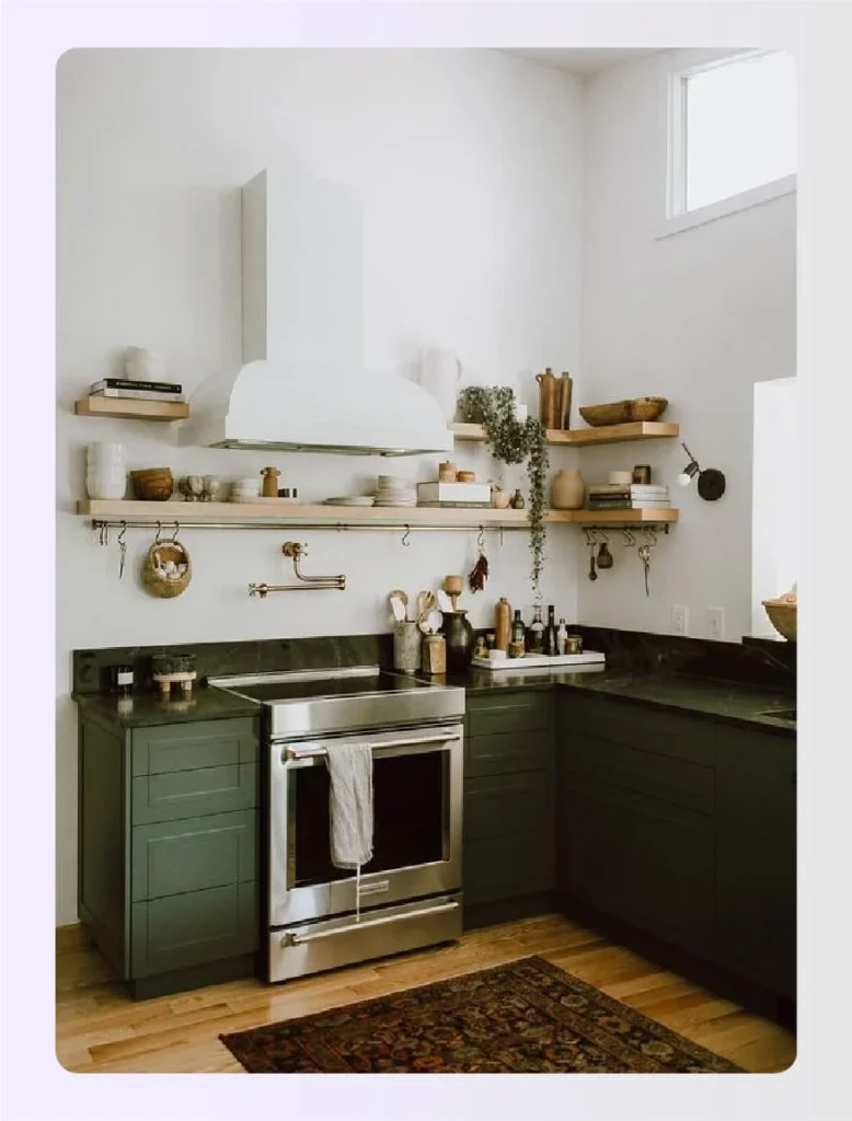 Dark green lower cabinets with open shelving 