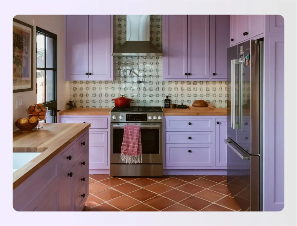 Pastel purple cabinets with terracotta floor tiles 