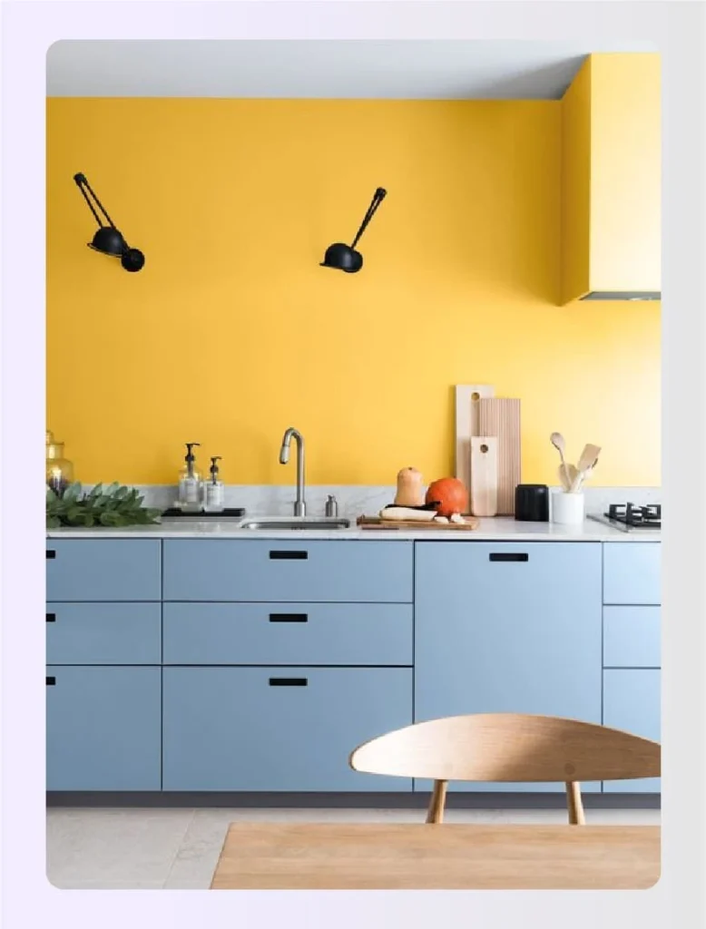Powder blue lower cabinets against yellow wall 