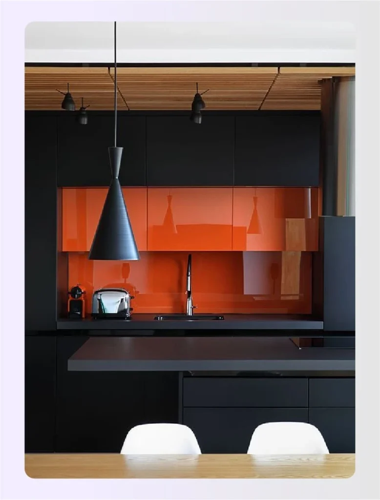 Sleek black cabinets with a pop of orange 