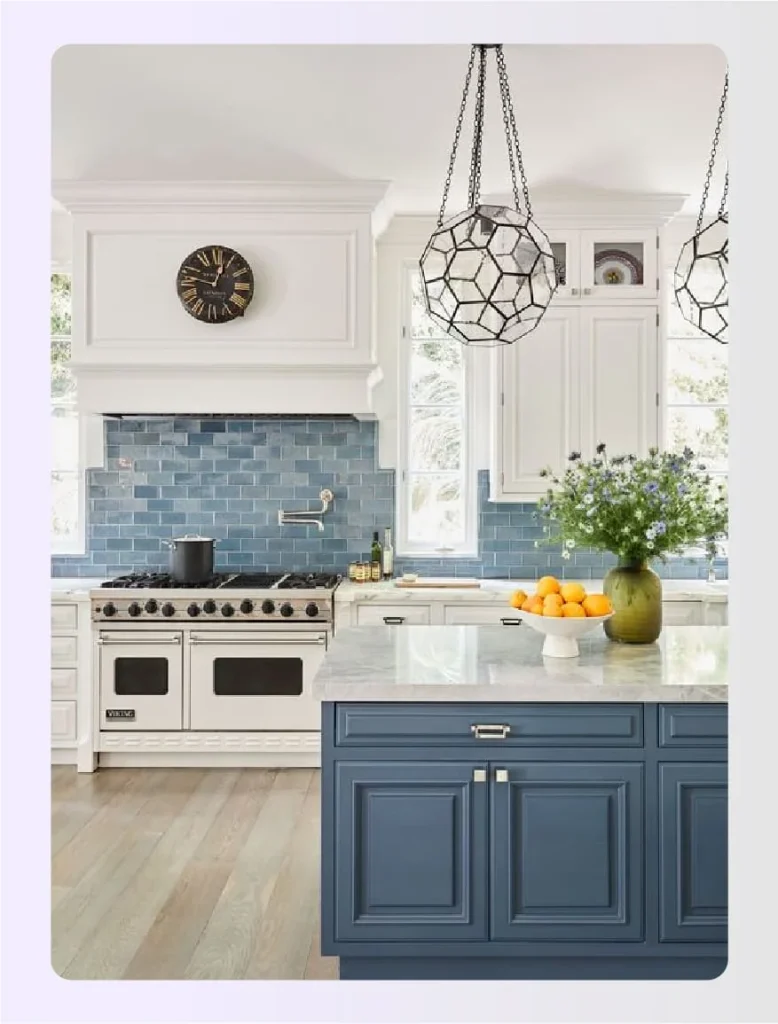 Spacious kitchen with blue cabinets and white island 