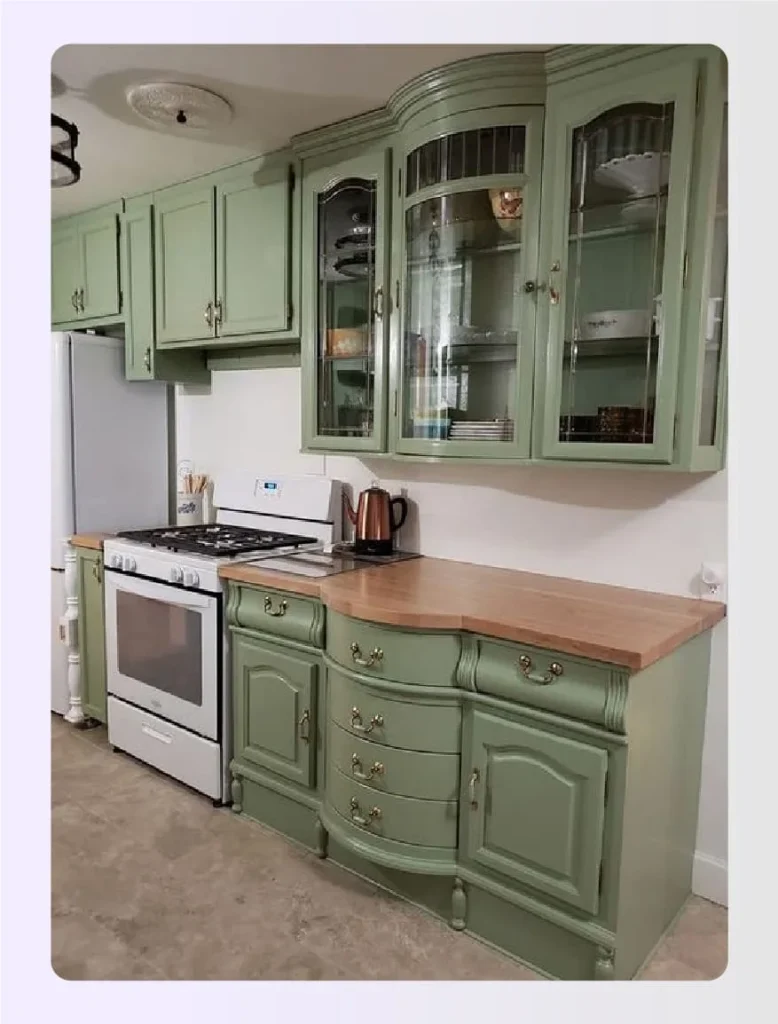 Vintage style green kitchen cabinetry and hutch 