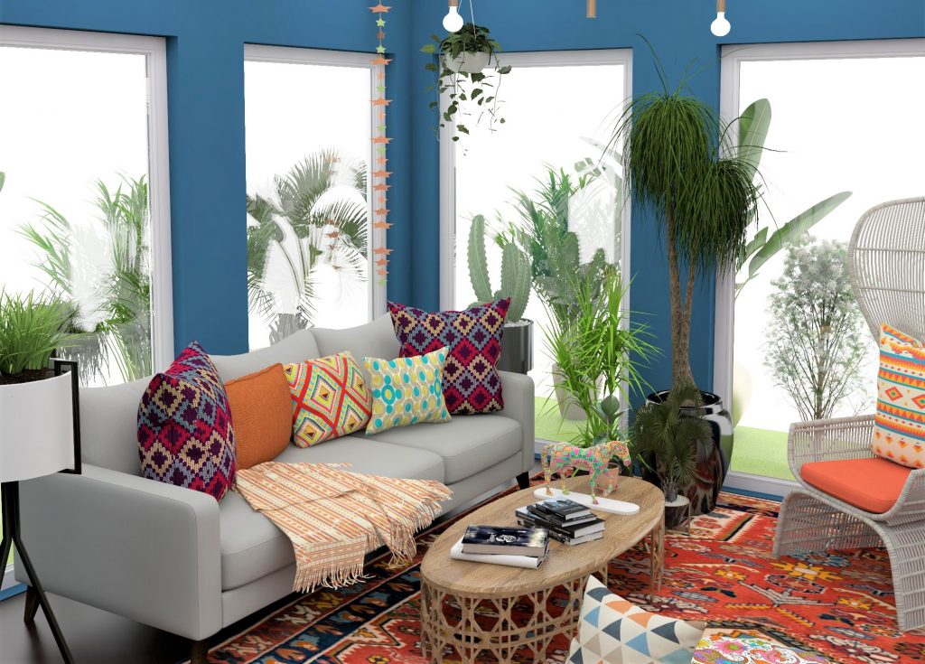 Bohemian-style living room with colorful pillows, plants, and a patterned rug.
