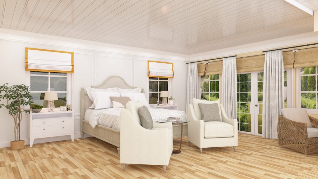 Farmhouse-style bedroom with white walls, wooden floors, and a cozy seating area.