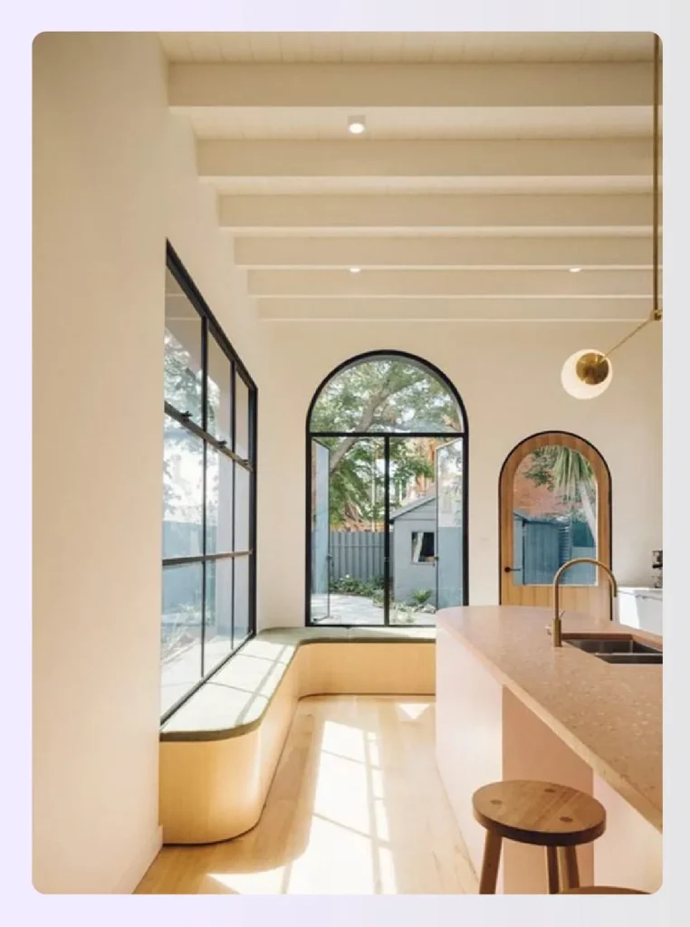 Large arched window in a bright modern kitchen Large arched window in a bright modern kitchen
